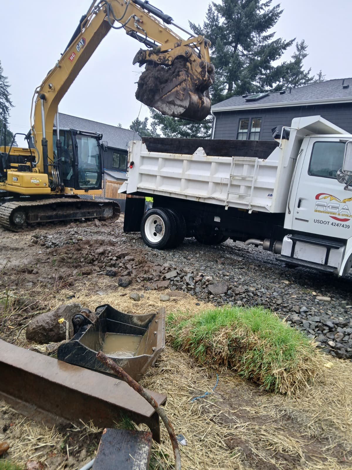 RGA excavator loading material into dump truck